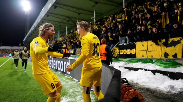 Jens Petter Hauge of Bodo/Glimt celebrates scoring his team's second goal with teammate Kasper Hogh