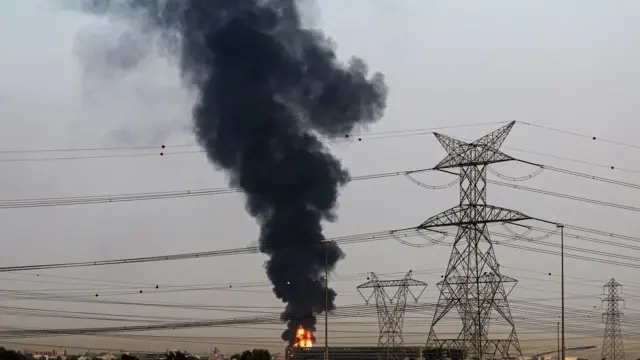 Smoke rises from an area near Dubai International Airport in Dubai, United Arab Emirates