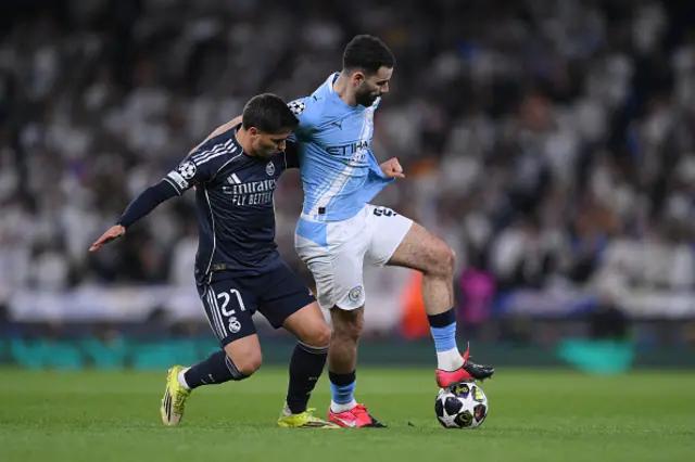 Brahim Diaz of Real Madrid and Rayan Ait-Nouri of Manchester City