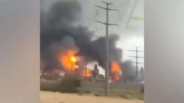 Flames and smoke billow into the air