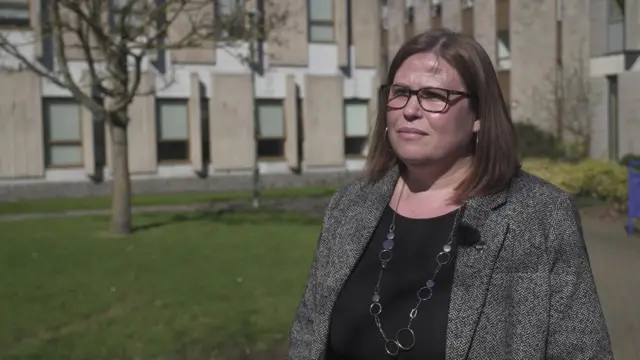 Professor Georgina Randsley de Moura looks to the left of the camera