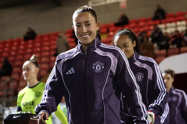 Maya Le Tissier of Manchester United leads the team out
