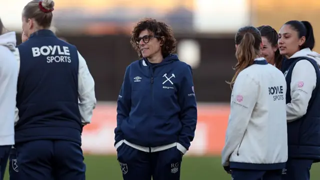 Rita Guarino, Manager of West Ham United, inspects the pitch p