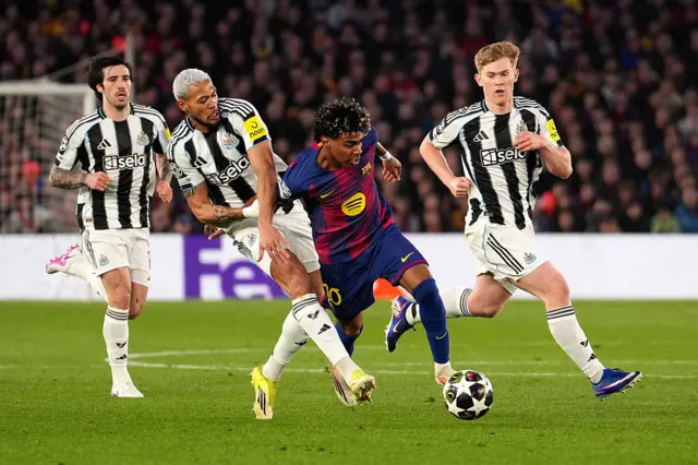 Joelinton and Lewis Hall challenging Lamine Yamal