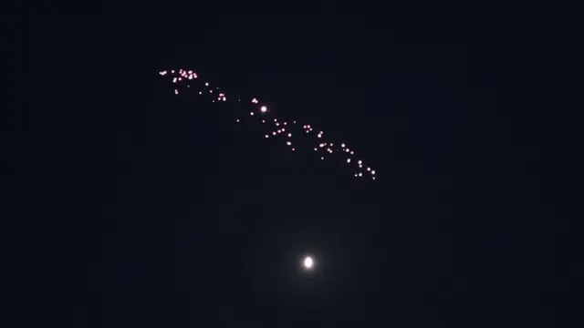 Missiles launched from Iran streak across the sky over Tel Aviv
