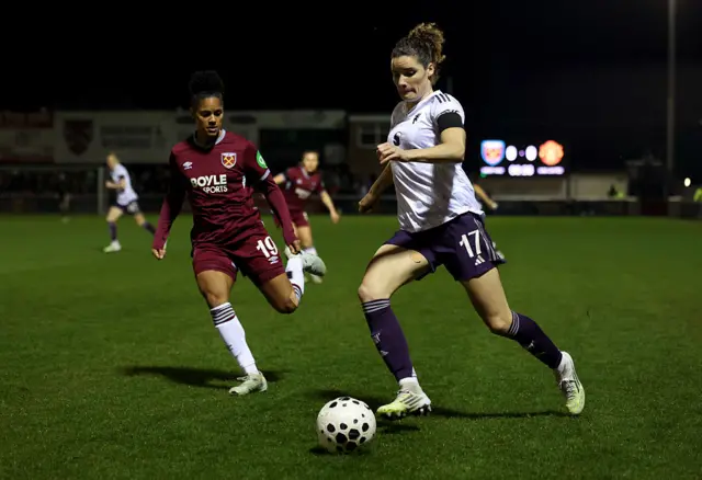 Dominique Janssen of Manchester United runs with the ball whilst under pressure from Shekiera Martinez of West Ham United