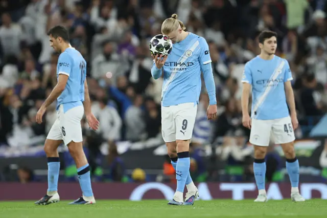 Manchester CIty look dejected after defeat by real Madrid in Champions League