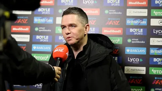 Mark Skinner, Manager of Manchester United, speaks to the media i
