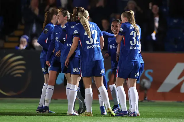 Alyssa Thompson of Chelsea celebrates scoring her team's first goal with teammates