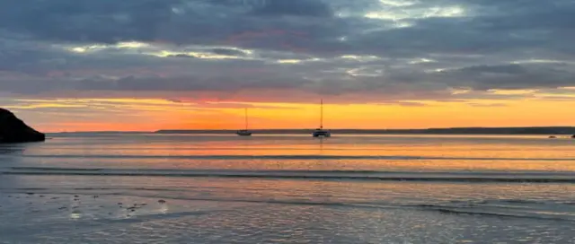 Two yachts in the sea at Hope Cove in Devon