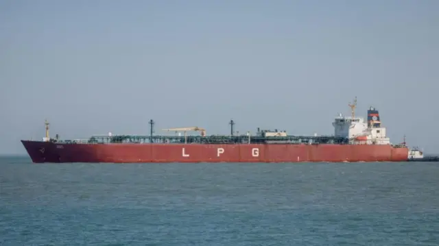A large vessel floating on water near the Strait of Hormuz.