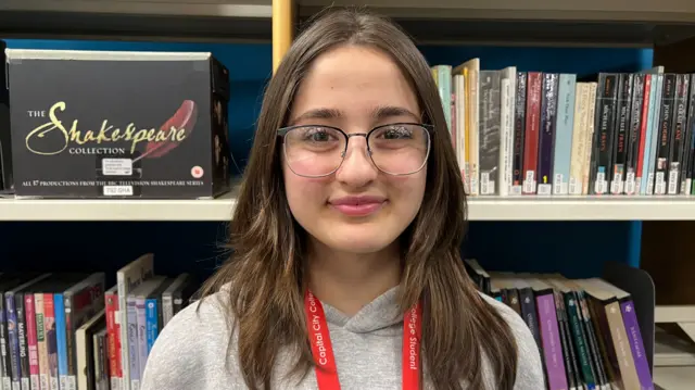 Hulya Cicek in a grey jumper.