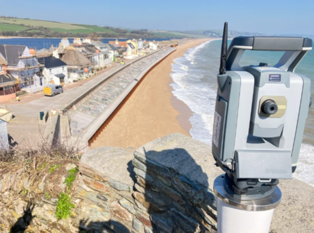 A view of Torcross from above. To the left you can see the houses along the front with scaffolding around it.
