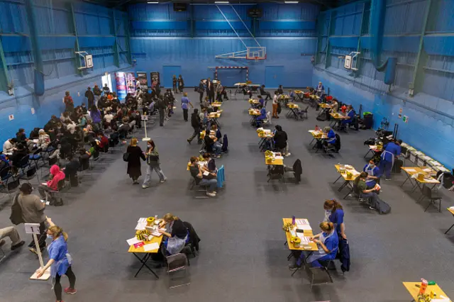 Vaccines are handed out at a sports hall at the University of Kent