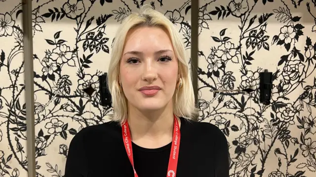 Adele Blossom in a black top.