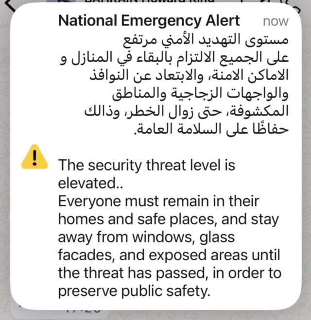 A screenshot of a message saying 'security threat level is elevated' in Qatar.