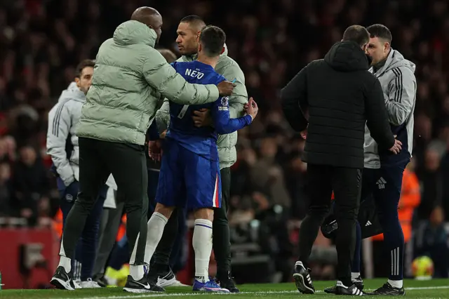 Chelsea's Portuguese midfielder Pedro Neto reacts as he is asked to leave the pitch after receiving a red card during the English Premier League football match between Arsenal and Chelsea at the Emirates Stadium in London on March 1, 2026.