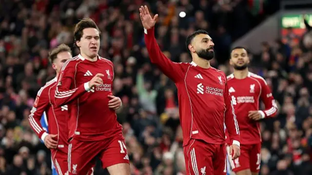 Mohamed Salah of Liverpool celebrates scoring his team's third goal