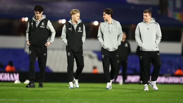 Middlesbrough players inspect the pitch