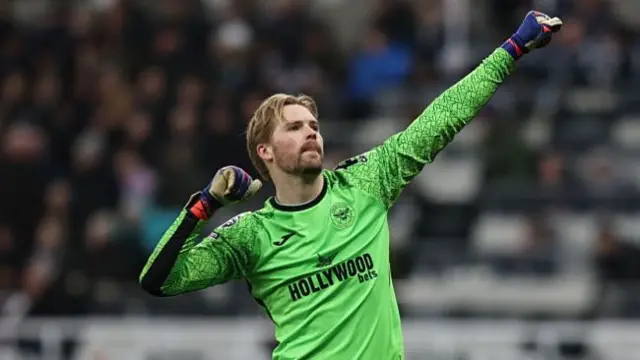 Caoimhin Kelleher of Brentford celebrates their third goal