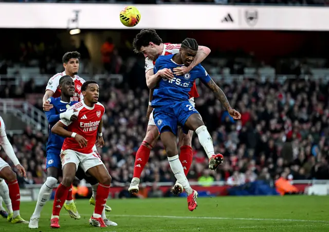 Jorrel Hato of Chelsea is challenged by Declan Rice of Arsenal as they compete for a header during the Premier League match between Arsenal and Chelsea at Emirates Stadium on March 01, 2026.
