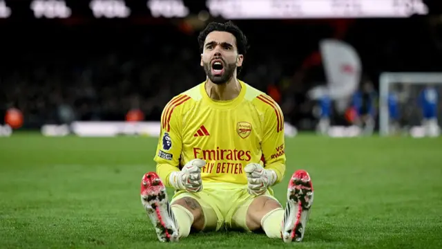 David Raya of Arsenal celebrates his side's second goal scored by team mate Jurrien Timber
