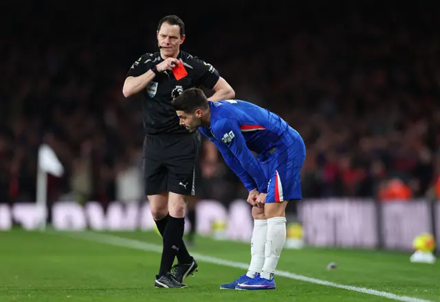 Chelsea's Pedro Neto is shown a red card by Referee Darren England during the Premier League match between Arsenal and Chelsea at Emirates Stadium on March 01, 2026.
