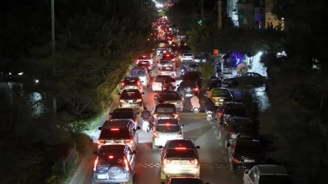 Lebanese people flee with their cars from the southern suburbs of Beirut, Lebanon