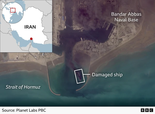 Satellite image shows a damaged ship near the entrance to Bandar Abbas Naval Base, with smoke over nearby facilities and a map inset locating the site in Iran.