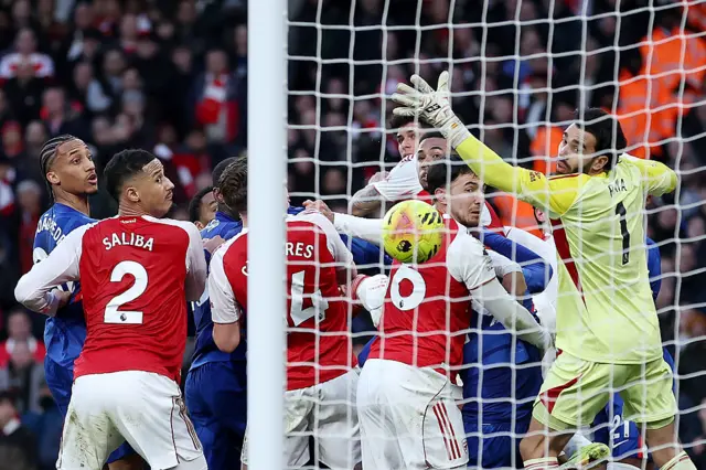 Players react as Piero Hincapie of Arsenal scores an own goal, resulting in the first goal for Chelsea
