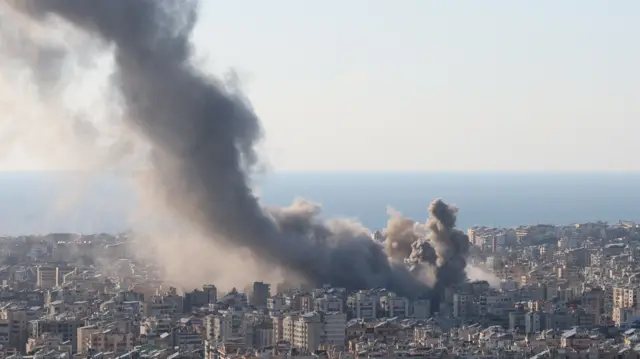 moke and dust rise after an Israeli strike on Beirut's southern suburbs, following an escalation between Hezbollah and Israel amid the U.S.-Israeli conflict with Iran, Lebanon