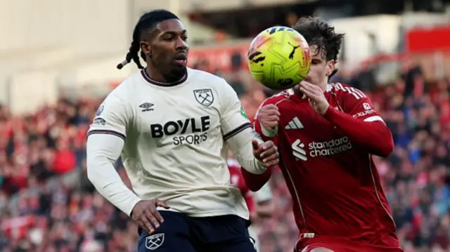 Adama Traore of West Ham United battles for possession with Milos Kerkez of Liverpool