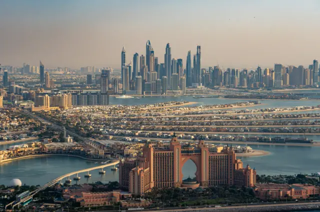 An aerial view over Dubai skyline, from the Palm island to the Dubai Marina.