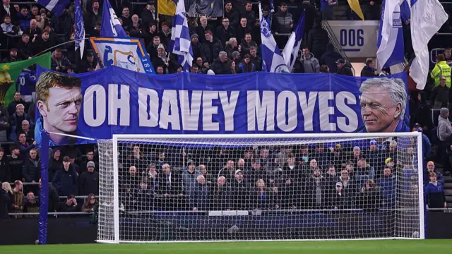 A banner at Everton reads 'Oh Davey Moyes'