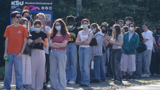 Students queuing to receive vaccines and antibiotics at the University of Kent campus in Canterbury