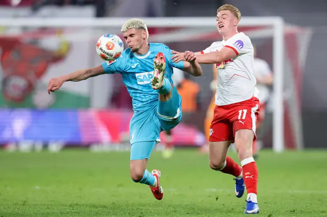 Hoffenheim's Brazilian defender Bernardo and Leipzig's Danish forward Conrad Harder vie for the ball