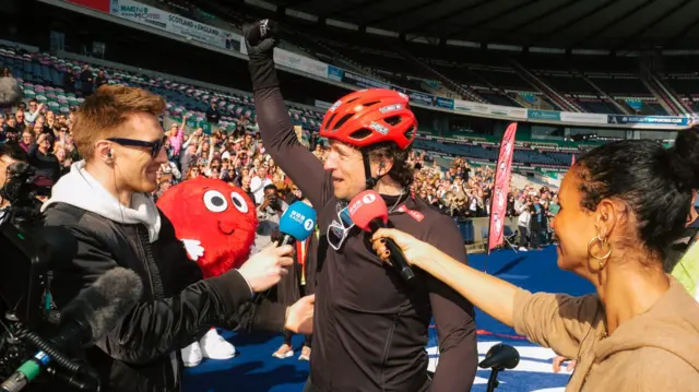 Greg James waves at crowds in Murrayfield, Edinburgh