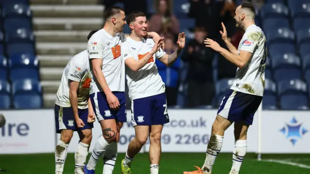 Alfie Devine celebrates with Preston team-mates