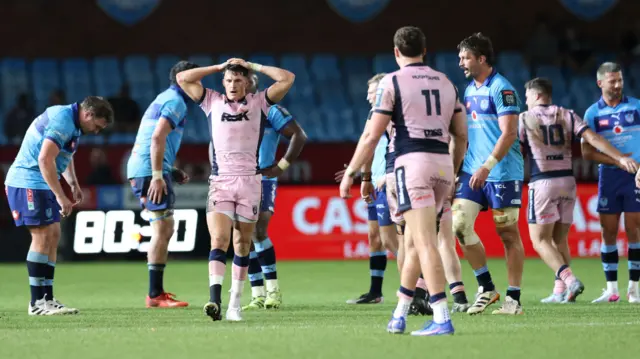 Elis Bevan and dejected Cardiff players