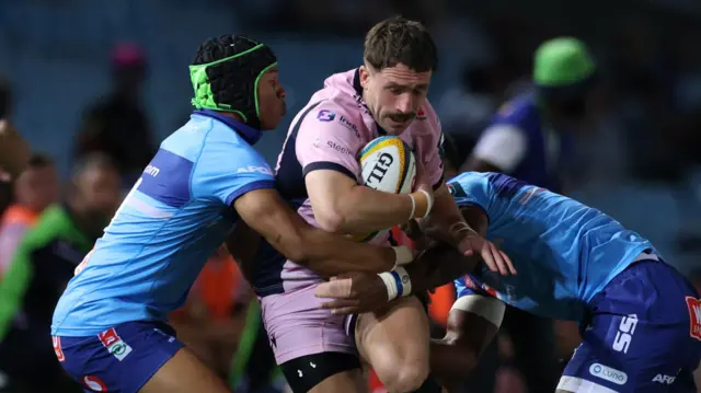 Harri Millard of Cardiff is tackled by Kurt-Lee Arendse and Canan Moodie