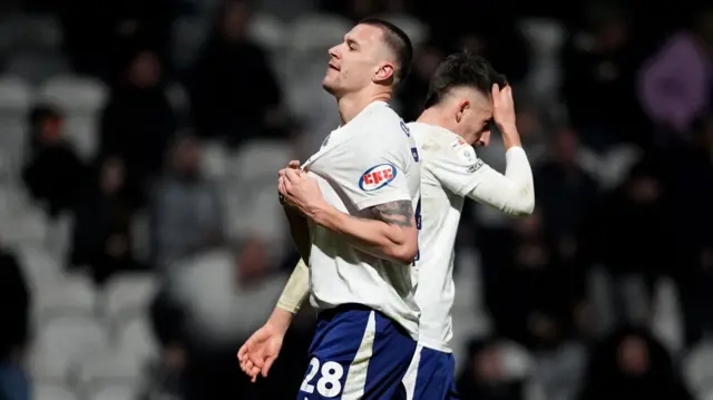Milutin Osmajic clutches the badge while celebrating his goal
