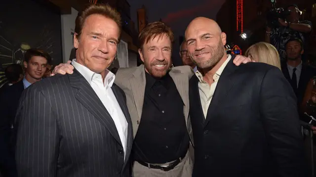 Arnold Schwarzenegger, Chuck Norris and Randy Couture pose for a picture in 20212