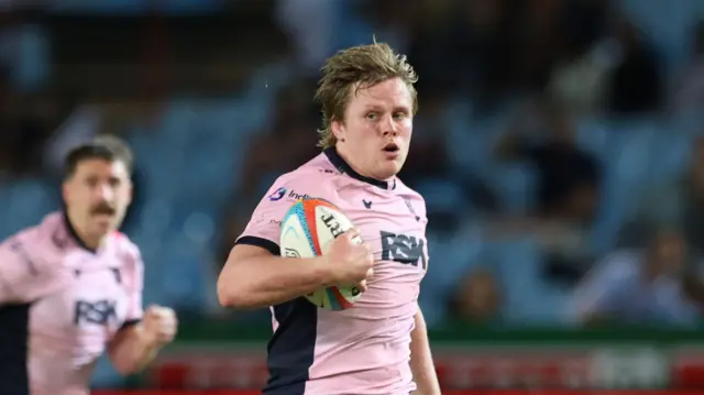 Dan Thomas runs with the ball