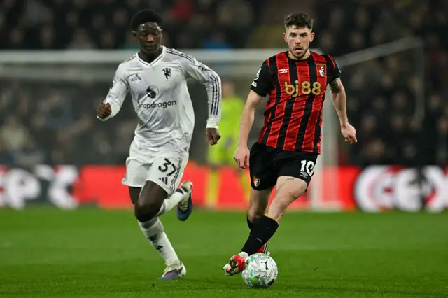 Manchester United's English midfielder #37 Kobbie Mainoo (L) fights for the ball with Bournemouth's Scottish midfielder #10 Ryan Christie (R) during the English Premier League football match between Bournemouth and Manchester United at the Vitality Stadium in Bournemouth