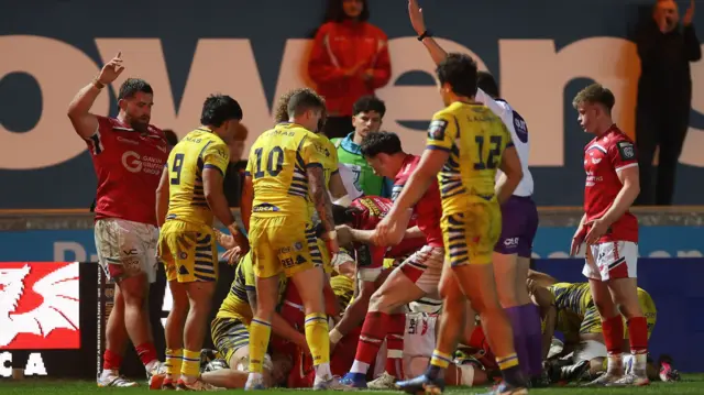 Scarlets celebrate Sam Lousi's try