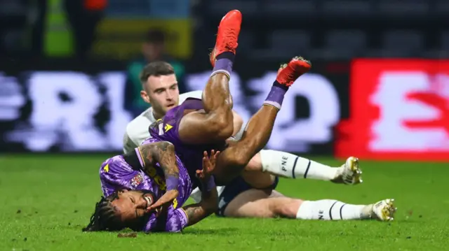 Sorba Thomas lies crumpled on the floor after Ben Whiteman's foul