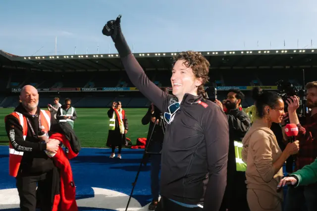 Greg James gives a thumbs up to the crowd in Murrayfield