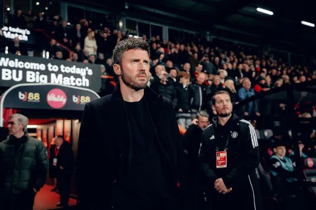 Head Coach Michael Carrick of Manchester United walks out