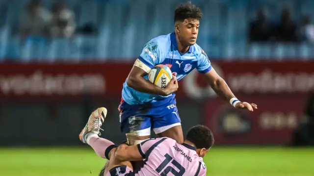 Canan Moodie is tackled by Ben Thomas