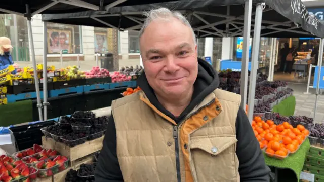 Jeb Hughes, pictured in front of his fruit stall in Canterbury High Street